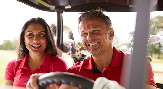 Couple in a golf cart