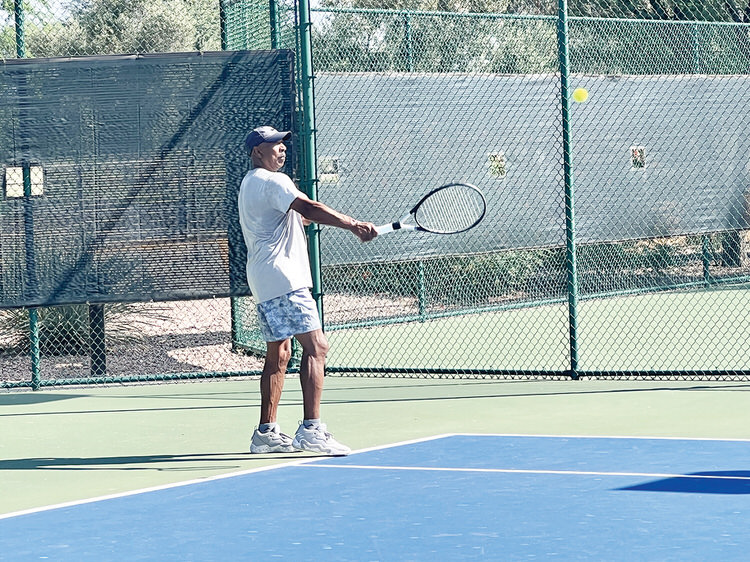 PebbleCreek active adult resident enjoying tennis