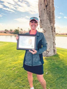 Tricia Curtis celebrates a hole in one